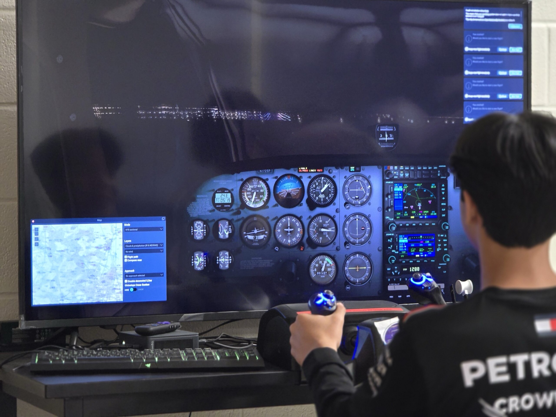 Student flying a night approach on the AlphaFlight simulator